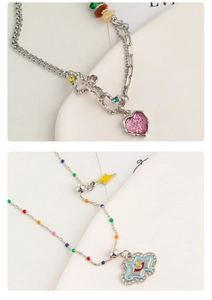 Detail of colorful beaded necklaces with pink heart and smiley cloud enamel pendants