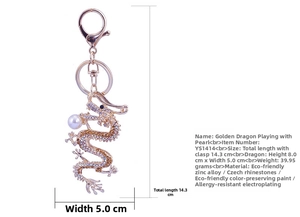 Detailed size view of a golden dragon keychain with rhinestones and faux pearl