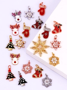 Detailed collection of gold plated Christmas charms featuring snowflakes and reindeer designs