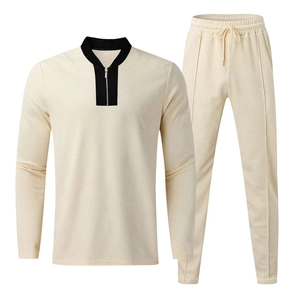 Close-up of men's waffle knit lounge set featuring quarter-zip collar and beige texture