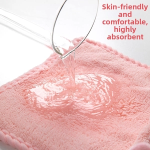 Pink microfiber hand towel with high water absorption and soft coral fleece texture