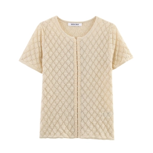 Detail of hollow knit texture and hook-and-eye closure on beige short sleeve cardigan