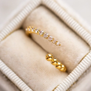 Elegant S925 silver gold beaded open ring with sparkling cubic zirconia on velvet