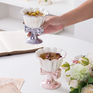 Elegant ceramic wine glass dessert cup with bow tie and wavy rim in pearlescent finish