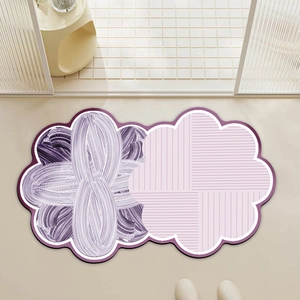Modern purple floral bath mat with anti-slip design placed at a bathroom entrance