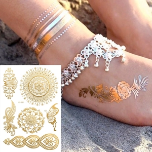 Gold and silver mandala henna lace temporary tattoo stickers with floral patterns on feet