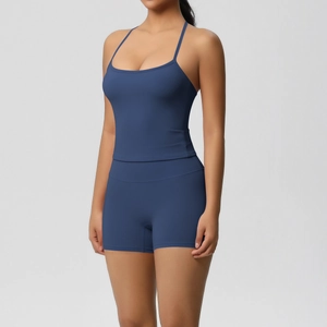 Detail of navy blue brushed sports set showing thin straps and high-waist yoga shorts