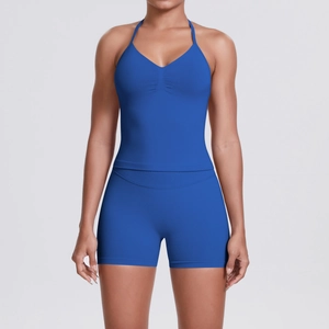 Close-up of royal blue yoga set featuring a halter neck top with ruched front details
