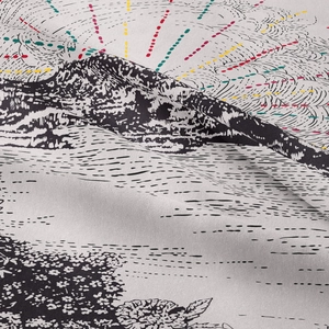 Detail of black and white printed tapestry showing hills sunbeams and floral texture