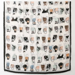 Close-up of lightweight scarf featuring colorful cartoon cat patterns and black border