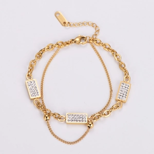 Detail of double-layer gold chain bracelet with white zircon stones and S.Steel stamp