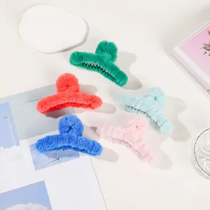 Detailed set of five plush hair claw clips in vibrant colors for autumn and winter styling