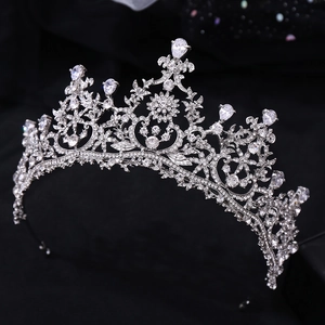 Detailed view of silver bridal crown featuring intricate floral patterns and AAA zircons