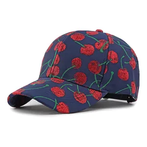 Navy blue baseball cap with red cherry embroidery and classic curved brim style