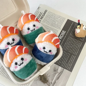 Cute plush salmon sushi keychain set with four expressive characters in bento box