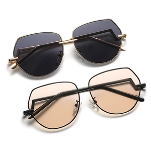 Modern aviator sunglasses with geometric metal frames in gold and black finishes