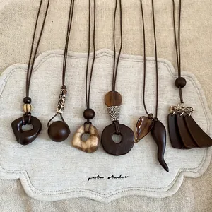 Bohemian geometric resin and wood pendant necklaces for women in earthy natural tones