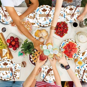 Close-up of Western Rodeo themed party plates and napkins with cowboy hats and cactus motifs