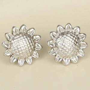 Detailed macro view of silver 304 stainless steel sunflower stud earrings with intricate petals