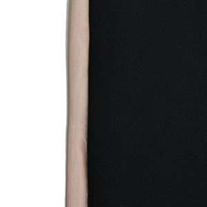 Macro detail of breathable beige mesh strap stitched to high-elastic black shapewear fabric