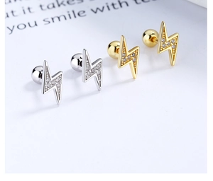 Macro shot of 925 sterling silver lightning bolt earrings with pavé zircon settings