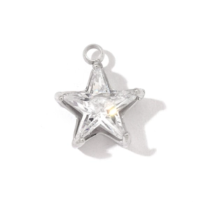 Macro shot of silver star pendant with faceted crystal gemstone and polished metal finish