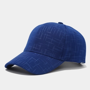 Close-up of a navy blue baseball cap showing detailed grid texture and six-panel stitch