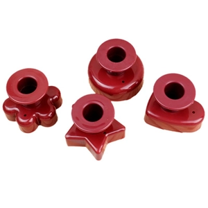 Red non-stick donut molds in flower, circle, star, and heart shapes for DIY baking tools