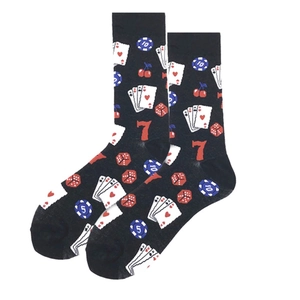 Detail of crew socks with poker chips, playing cards, and gambling themed patterns on black fabric