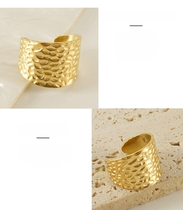 Detailed macro view of 18K gold-plated stainless steel ring with textured lava finish