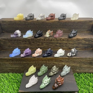 Detail view of assorted 4cm natural semi-precious stone dragon head crystal carvings