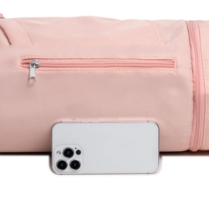 Detailed close-up of a pink yoga bag pocket featuring a silver zipper with phone scale