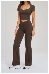 Detail of dark coffee yoga set with high-waisted flared pants and functional side pockets