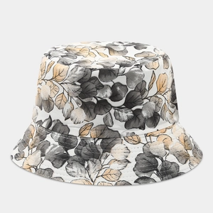 Close-up of leaf pattern embroidery and reinforced stitching on cotton bucket hat
