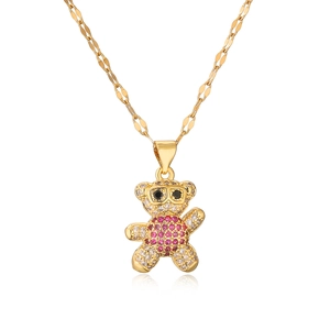 Gold plated bear necklace with pink crystal belly and paved zirconias on white background