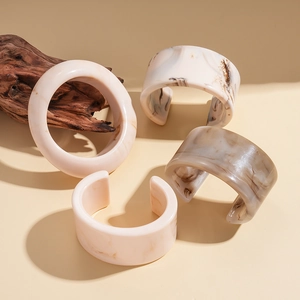 Vintage geometric resin open bangle set with marble texture in cream and beige tones