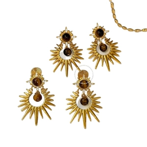 Retro starburst earrings in gold finish featuring tiger eye stone and zircon accents