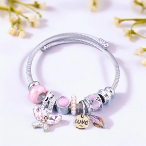 Detail of DIY stainless steel charm bracelet with crystal butterflies and heart charms
