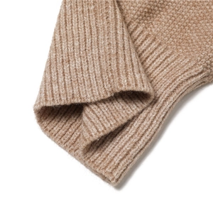 Detailed close-up of camel wool blend ribbed knit texture on a winter hooded scarf