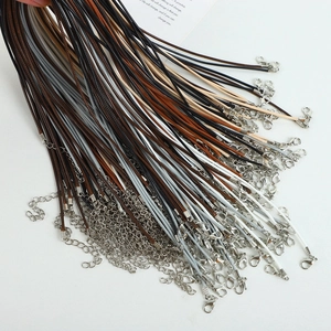 Detailed close-up of multi-colored wax cord necklaces with metal lobster clasps and chains