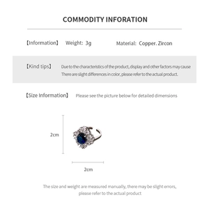 Detailed close-up showing materials and dimensions of a silver drop zircon ring