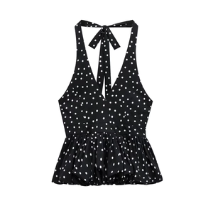 Polka dot halter top with backless tie design and tiered ruffle hem on white background