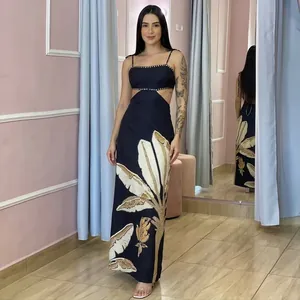 Hawaiian tropical leaf print maxi dress with sexy waist cutouts and beaded details
