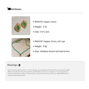 Detailed view of vintage gold and green earrings with necklace showing product measurements
