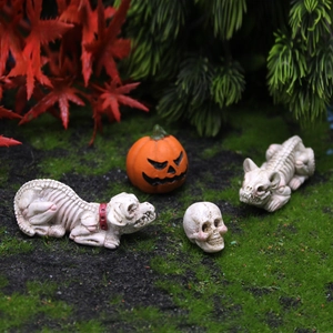 Miniature Halloween skeleton set with dog, cat, and skull figures on green moss