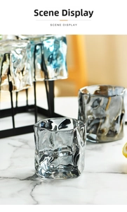 Detail of glacier textured glasses on a modern black metal rack for storage