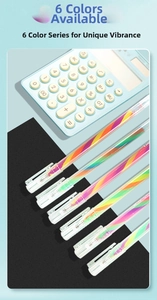 Close-up of 6 rainbow gel pens with clear barrels showing spiral ink on modern background