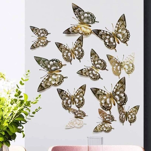 Detailed view of gold hollow 3D butterfly wall stickers in a modern home interior setting