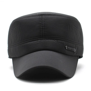 Close-up of black PU flat top hat with metallic Men's tag and fine stitching detail