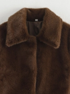 Detail of premium brown faux fur jacket showing rich texture and classic lapel collar
